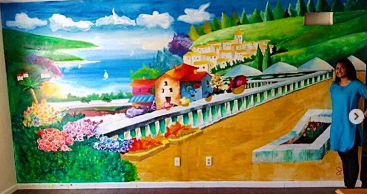 Mediterranean coastal village mural on an interior wall
